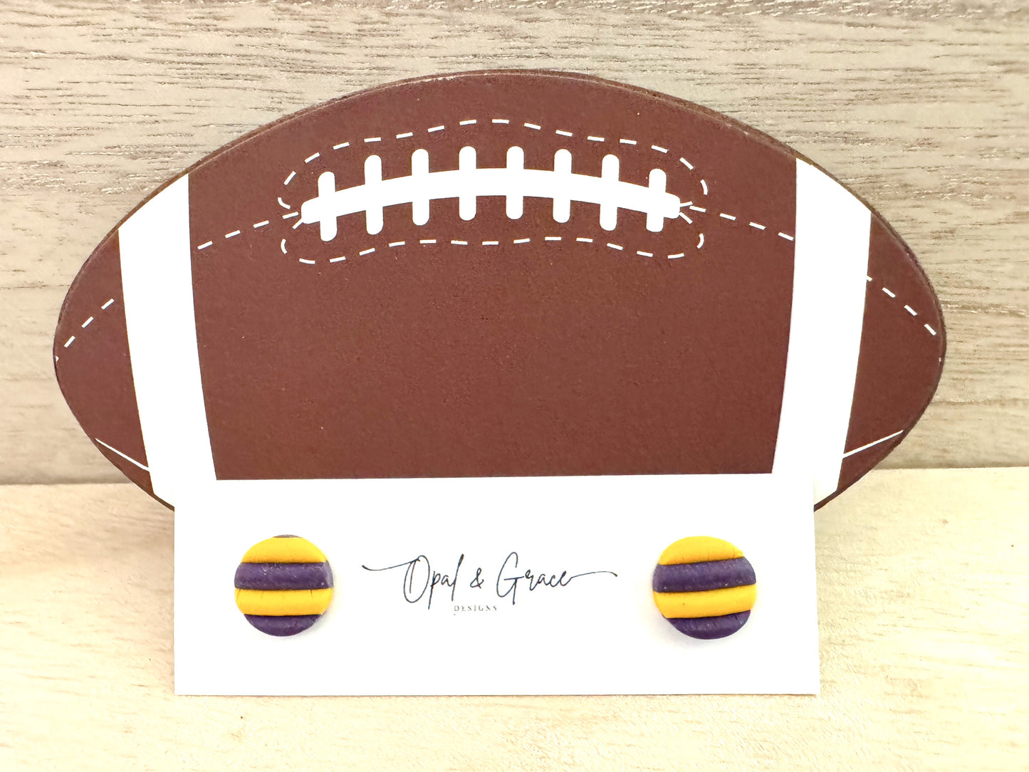 Purple and gold stripestuds